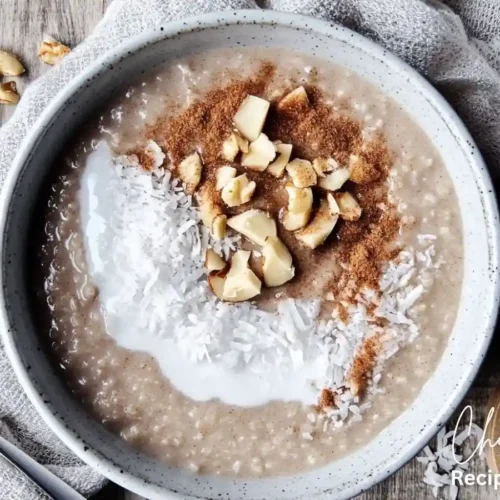 A bowl of Cream of Rice porridge topped with shredded coconut, chopped nuts, and cinnamon.